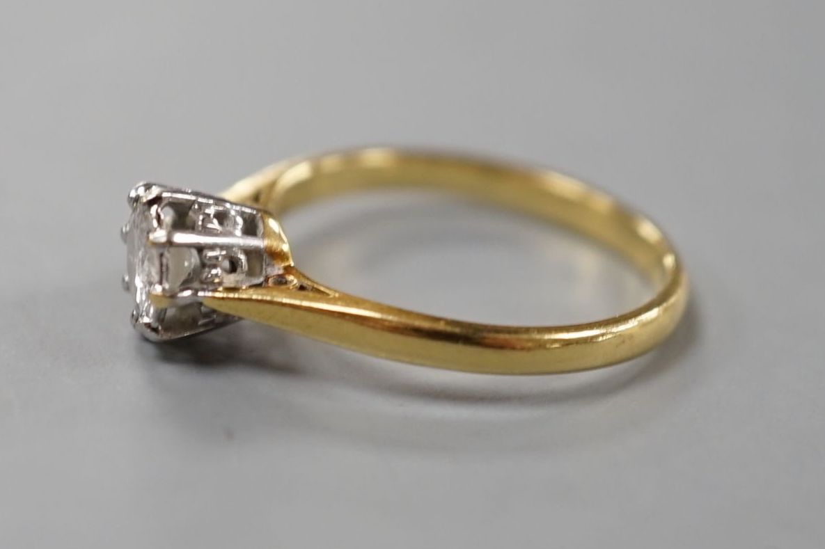 An 18ct and solitaire diamond set ring, size M/N, gross weight 2.9 grams
